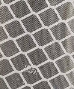 Close-up of gray fabric with a white diamond lattice pattern.