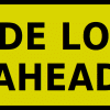 wide-load-ahead-sign » Highway 1 Warning sign: wide load ahead (yellow rectangle with rounded corners and bold black text)