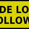 wide-load-follows-sign » Highway 1 Yellow rounded-corner warning sign reading 'WIDE LOAD FOLLOWS' in bold black letters.